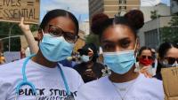Two nurses at protest.